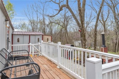 Enjoy lakeside living with this charming and move-in ready cabin on Sugar Valley Lakes Golf Course in Kansas - for sale on GolfHomes.com, golf home, golf lot