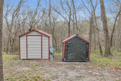 Enjoy lakeside living with this charming and move-in ready cabin on Sugar Valley Lakes Golf Course in Kansas - for sale on GolfHomes.com, golf home, golf lot