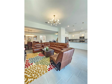 Built in 2024, this 4 bedroom / 3 bathroom Newcastle model on The Oasis Club at Champions Gate in Florida - for sale on GolfHomes.com, golf home, golf lot