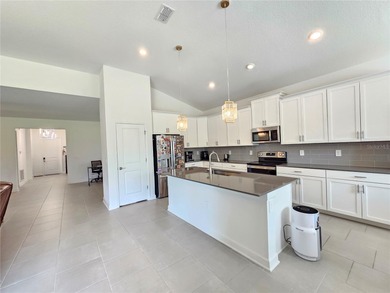 Built in 2024, this 4 bedroom / 3 bathroom Newcastle model on The Oasis Club at Champions Gate in Florida - for sale on GolfHomes.com, golf home, golf lot