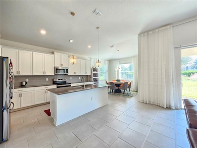 Built in 2024, this 4 bedroom / 3 bathroom Newcastle model on The Oasis Club at Champions Gate in Florida - for sale on GolfHomes.com, golf home, golf lot