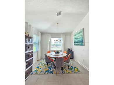 Built in 2024, this 4 bedroom / 3 bathroom Newcastle model on The Oasis Club at Champions Gate in Florida - for sale on GolfHomes.com, golf home, golf lot