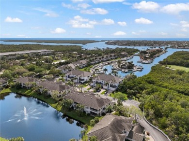 Nicely appointed first floor coach home located directly across on Windstar on Naples Bay in Florida - for sale on GolfHomes.com, golf home, golf lot