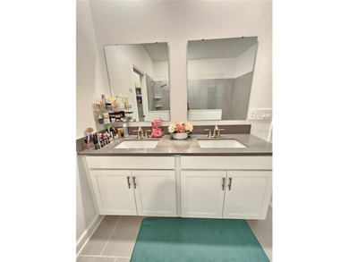 Built in 2024, this 4 bedroom / 3 bathroom Newcastle model on The Oasis Club at Champions Gate in Florida - for sale on GolfHomes.com, golf home, golf lot