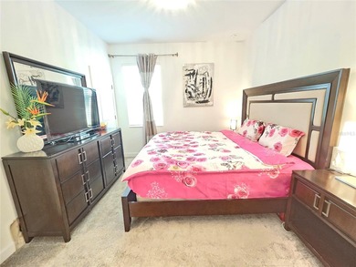 Built in 2024, this 4 bedroom / 3 bathroom Newcastle model on The Oasis Club at Champions Gate in Florida - for sale on GolfHomes.com, golf home, golf lot