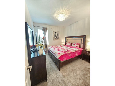 Built in 2024, this 4 bedroom / 3 bathroom Newcastle model on The Oasis Club at Champions Gate in Florida - for sale on GolfHomes.com, golf home, golf lot