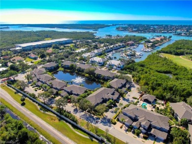 Nicely appointed first floor coach home located directly across on Windstar on Naples Bay in Florida - for sale on GolfHomes.com, golf home, golf lot