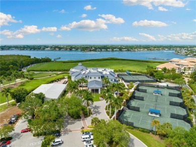 Nicely appointed first floor coach home located directly across on Windstar on Naples Bay in Florida - for sale on GolfHomes.com, golf home, golf lot