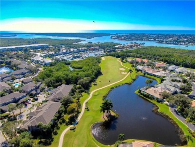 Nicely appointed first floor coach home located directly across on Windstar on Naples Bay in Florida - for sale on GolfHomes.com, golf home, golf lot