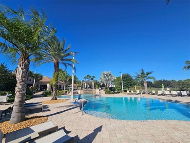 Built in 2024, this 4 bedroom / 3 bathroom Newcastle model on The Oasis Club at Champions Gate in Florida - for sale on GolfHomes.com, golf home, golf lot