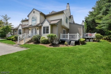 Experience elevated living in this sun-drenched, end-unit on Echo Lake Country Club in New Jersey - for sale on GolfHomes.com, golf home, golf lot