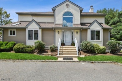 Experience elevated living in this sun-drenched, end-unit on Echo Lake Country Club in New Jersey - for sale on GolfHomes.com, golf home, golf lot