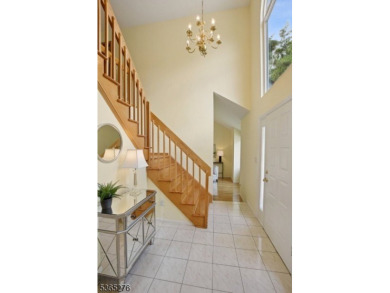 Experience elevated living in this sun-drenched, end-unit on Echo Lake Country Club in New Jersey - for sale on GolfHomes.com, golf home, golf lot
