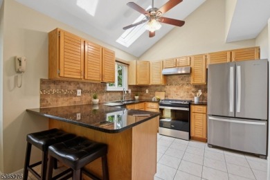 Experience elevated living in this sun-drenched, end-unit on Echo Lake Country Club in New Jersey - for sale on GolfHomes.com, golf home, golf lot