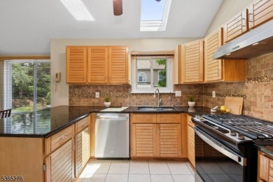 Experience elevated living in this sun-drenched, end-unit on Echo Lake Country Club in New Jersey - for sale on GolfHomes.com, golf home, golf lot