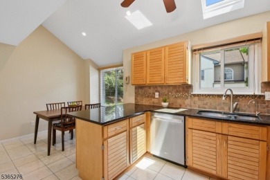 Experience elevated living in this sun-drenched, end-unit on Echo Lake Country Club in New Jersey - for sale on GolfHomes.com, golf home, golf lot