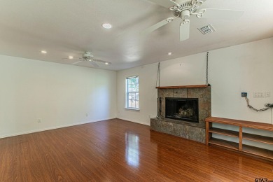 Sit on the front porch of this spacious, charming house and on Holly Lake Ranch Golf Club in Texas - for sale on GolfHomes.com, golf home, golf lot