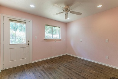 Sit on the front porch of this spacious, charming house and on Holly Lake Ranch Golf Club in Texas - for sale on GolfHomes.com, golf home, golf lot