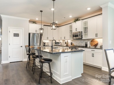 Experience luxury living in this stunning David Weekley home on Westport Golf Club in North Carolina - for sale on GolfHomes.com, golf home, golf lot