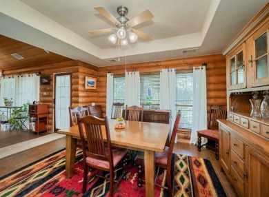 This stunning log cabin features 3 bedrooms, 2 bathrooms, and on Lago Vista Golf Club in Texas - for sale on GolfHomes.com, golf home, golf lot