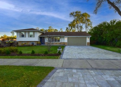 This exquisite, four-bedroom home, nestled in a serene Downers on Green Meadows Golf Club in Illinois - for sale on GolfHomes.com, golf home, golf lot