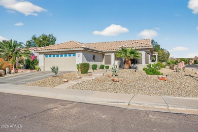 This beautifully remodeled Willow floor plan features walnut on Sun City Grand Golf Couse and Club in Arizona - for sale on GolfHomes.com, golf home, golf lot