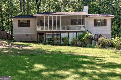 Start collecting lake-life stories before summer slips away on Turtle Cove Golf Course in Georgia - for sale on GolfHomes.com, golf home, golf lot