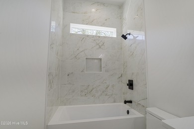 This home is under construction at this timepletion date 6/2026 on Brunswick Plantation and Golf Resorts in North Carolina - for sale on GolfHomes.com, golf home, golf lot