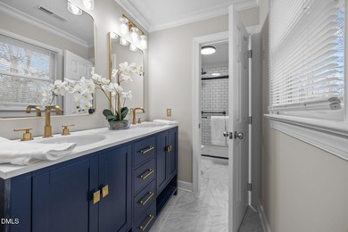 A rocking chair front porch welcomes you to your new home. Enter on Hedingham Golf and Athletic Club in North Carolina - for sale on GolfHomes.com, golf home, golf lot