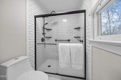 A rocking chair front porch welcomes you to your new home. Enter on Hedingham Golf and Athletic Club in North Carolina - for sale on GolfHomes.com, golf home, golf lot