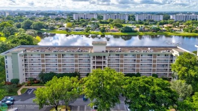 Enjoy serene water views of the lake and fountain as soon as you on Palm-Aire Country Club and Resort - Palms in Florida - for sale on GolfHomes.com, golf home, golf lot