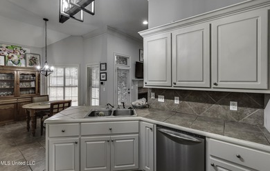 NEW ROOF - FEBRUARY 2026! Experience resort style living in this on Lake Caroline Golf Club in Mississippi - for sale on GolfHomes.com, golf home, golf lot