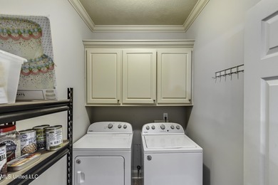 NEW ROOF - FEBRUARY 2026! Experience resort style living in this on Lake Caroline Golf Club in Mississippi - for sale on GolfHomes.com, golf home, golf lot