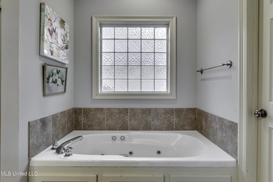 NEW ROOF - FEBRUARY 2026! Experience resort style living in this on Lake Caroline Golf Club in Mississippi - for sale on GolfHomes.com, golf home, golf lot