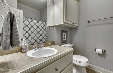 NEW ROOF - FEBRUARY 2026! Experience resort style living in this on Lake Caroline Golf Club in Mississippi - for sale on GolfHomes.com, golf home, golf lot