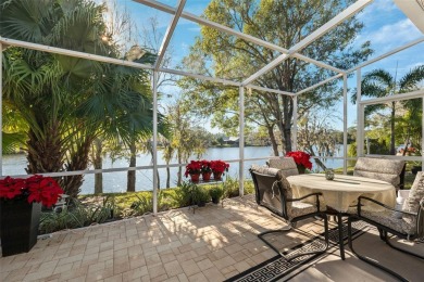 Welcome to this charming 3-bedroom, 2-bathroom WATERFRONT home on East Lake Woodlands Country Club in Florida - for sale on GolfHomes.com, golf home, golf lot