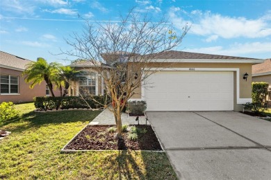 Welcome to this charming 3-bedroom, 2-bathroom WATERFRONT home on East Lake Woodlands Country Club in Florida - for sale on GolfHomes.com, golf home, golf lot