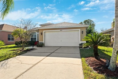Welcome to this charming 3-bedroom, 2-bathroom WATERFRONT home on East Lake Woodlands Country Club in Florida - for sale on GolfHomes.com, golf home, golf lot