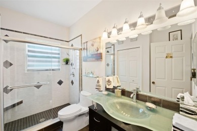 Welcome to this charming 3-bedroom, 2-bathroom WATERFRONT home on East Lake Woodlands Country Club in Florida - for sale on GolfHomes.com, golf home, golf lot