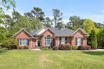 Beautiful 5Bds/3Ba brick home on a quiet, friendly street. Your on Gates Four Golf and Country Club in North Carolina - for sale on GolfHomes.com, golf home, golf lot