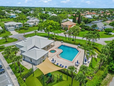 Step into paradise with this 2-bed, 2.5-bath townhouse nestled on Riverbend Golf Club in Florida - for sale on GolfHomes.com, golf home, golf lot