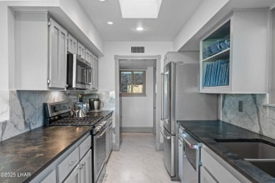 Welcome to 393 Hagen Way, a striking mid-century modern villa on London Bridge Golf Course in Arizona - for sale on GolfHomes.com, golf home, golf lot