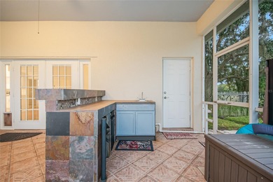 Spacious and well-maintained, this 5-bedroom, 3-bath POOL home on Remington Golf Club in Florida - for sale on GolfHomes.com, golf home, golf lot