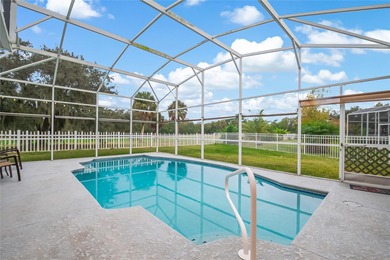 Spacious and well-maintained, this 5-bedroom, 3-bath POOL home on Remington Golf Club in Florida - for sale on GolfHomes.com, golf home, golf lot