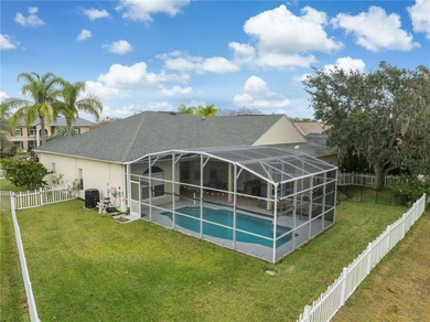 Spacious and well-maintained, this 5-bedroom, 3-bath POOL home on Remington Golf Club in Florida - for sale on GolfHomes.com, golf home, golf lot