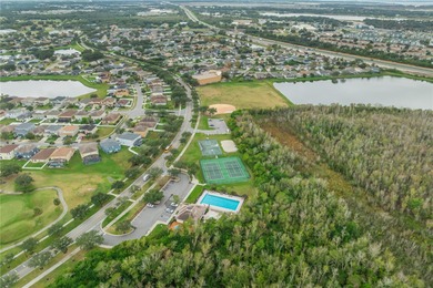 Spacious and well-maintained, this 5-bedroom, 3-bath POOL home on Remington Golf Club in Florida - for sale on GolfHomes.com, golf home, golf lot