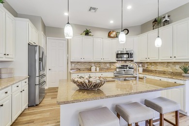 WARM, WELCOMING AND BEAUTIFULLY UPDATED THROUGHOUT! Meticulous on The Legacy Golf and Tennis Club in Florida - for sale on GolfHomes.com, golf home, golf lot