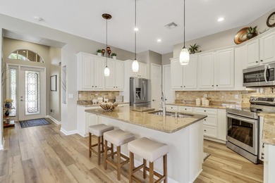 WARM, WELCOMING AND BEAUTIFULLY UPDATED THROUGHOUT! Meticulous on The Legacy Golf and Tennis Club in Florida - for sale on GolfHomes.com, golf home, golf lot