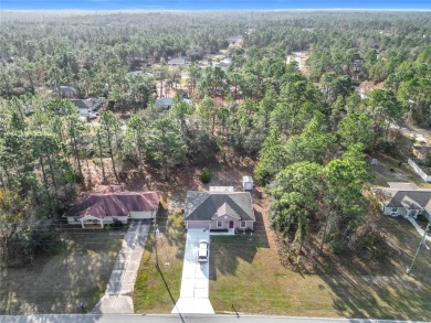 Welcome to this charming 3 bedroom, 2 bath, 2 car garage home on Citrus Springs Country Club in Florida - for sale on GolfHomes.com, golf home, golf lot