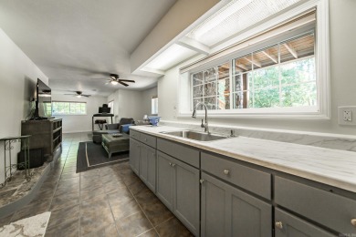 Tucked into a serene, park-like setting, this beautifully on  in Arkansas - for sale on GolfHomes.com, golf home, golf lot